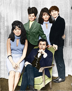 Phil Spector (sitting) with George Harrison and the Ronettes