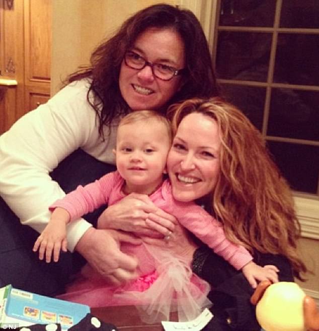Happy days: Rounds was the adoptive mother of O'Donnell's youngest daughter Dakota, 4, but lost custody of the girl in 2015 (Rounds and O'Donnell above with Dakota in January 2014) 