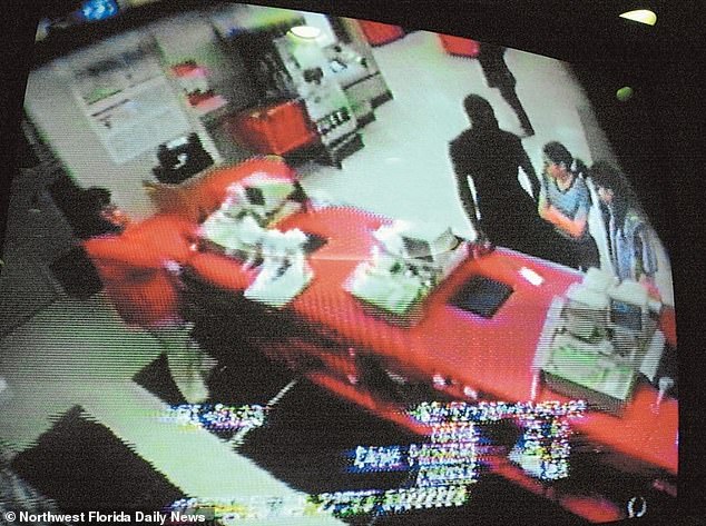 Surveillance footage shows the deadly trio purchasing the meat cleaver that was used to cut Cordell Richard's throat in 1999