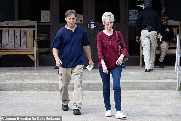 Sheila Fletcher, 64, was seen returning to East Feliciana Parish Jail - from she was released Tuesday night - to pick up her husband Wednesday morning after he posted $300,000 bond