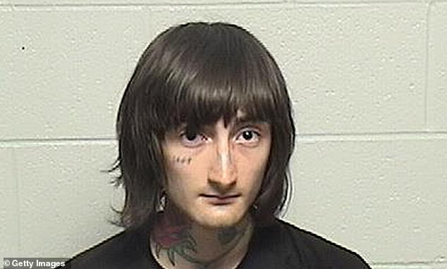Robert 'Bobby' Crimo, 21, is expressionless in a mugshot that was released Wednesday
