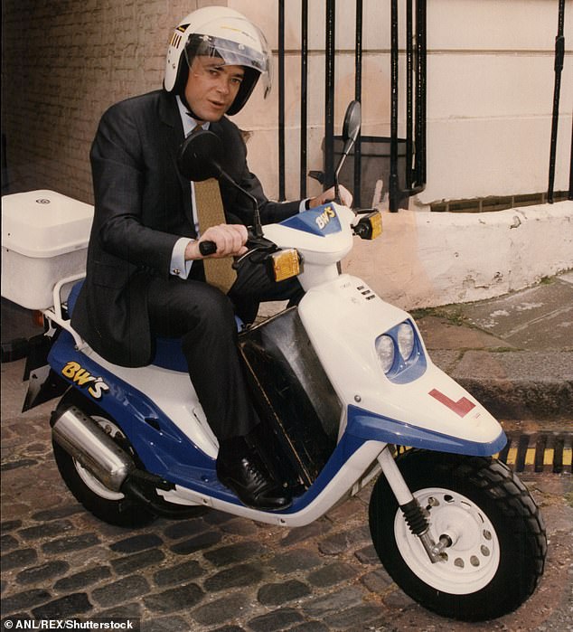 Ian photographed trying to drive a moped while wearing a suit and tie. Three years ago, in the middle of the Greek financial crisis, he launched an organisation with his brother that has raised millions of euros to save several hundred businesses