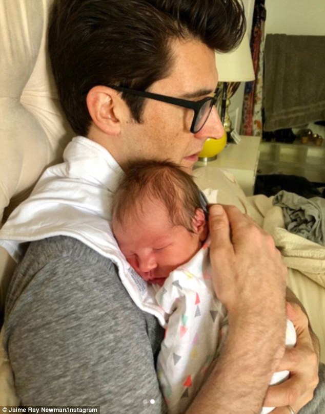 Orgullosa: Jaime compartió esta instantánea con su esposo Guy Nattiv, de 45 años, abrazando a su recién nacida Alma Ness Newman Nattiv, quien nació el martes.